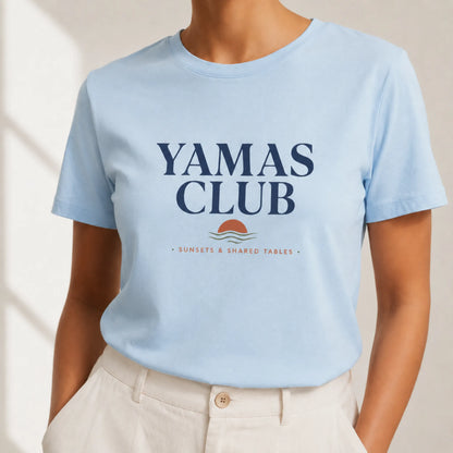 TP HERO: Light blue t-shirt with 'Yamas Club' text and graphics on a plain background